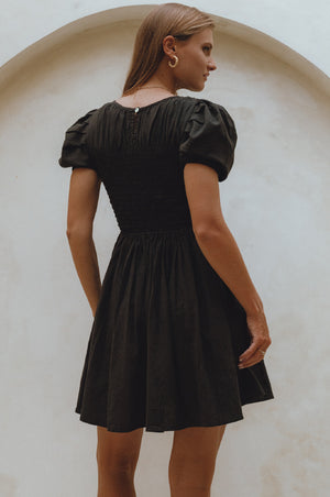 
                  
                    Elodie Smocked Linen Mini Dress
                  
                