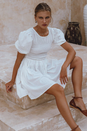 
                  
                    Elodie Smocked Linen Mini Dress
                  
                